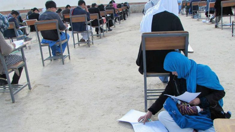Afghan Woman's Incredible Photo Nursing Her Baby While Appearing For University Entrance Exam Goes Viral