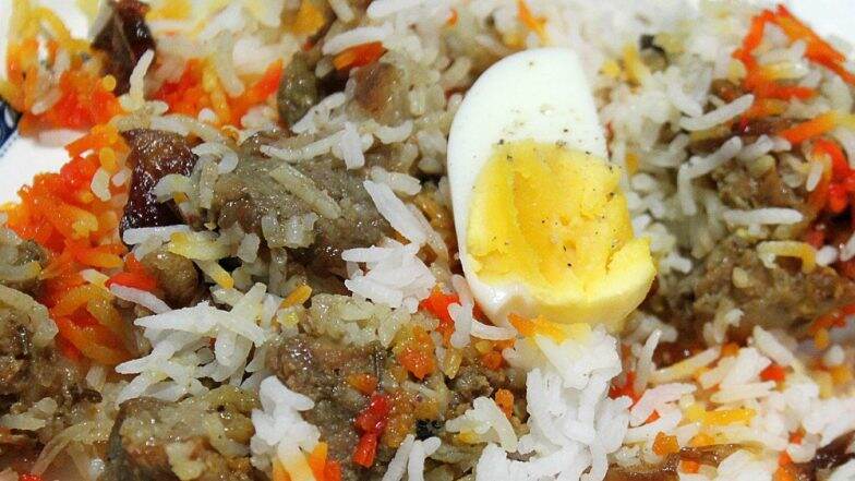 Mutton Biryani Served As Prasad in Tamil Nadu’s Muniyandi Temple During Mega Feast Mutton Biryani Served As Prasad in Tamil Nadu’s Muniyandi Temple During Mega Feast