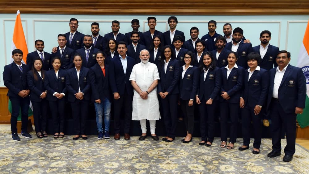 Prime Minister Narendra Modi Striking a Pose with Winning Members of Indian Team at CWG 2018. Prime Minister Narendra Modi Striking a Pose with Winning Members of Indian Team at CWG 2018.