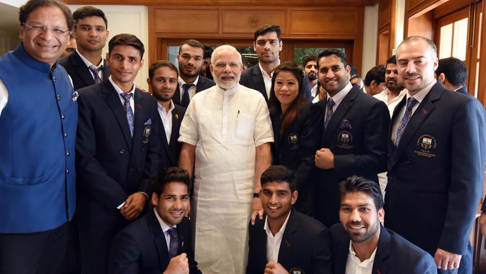 Prime Minister Narendra Modi Met Members of Winning Indian Boxing Team. Also in the picture is MC Mary Kom, Vikas Krishan, Gaurav Solanki, Amit, Satish Kumar, Manish Kaushik, Manoj Kumar, Naman Tanwar, and Mohammed. Prime Minister Narendra Modi Met Members of Winning Indian Boxing Team. Also in the picture is MC Mary Kom, Vikas Krishan, Gaurav Solanki, Amit, Satish Kumar, Manish Kaushik, Manoj Kumar, Naman Tanwar, and Mohammed.