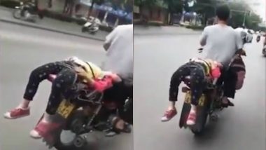Chinese Father Forcefully Takes Reluctant Daughter to School by Tying Her on Bike, Video Goes Viral