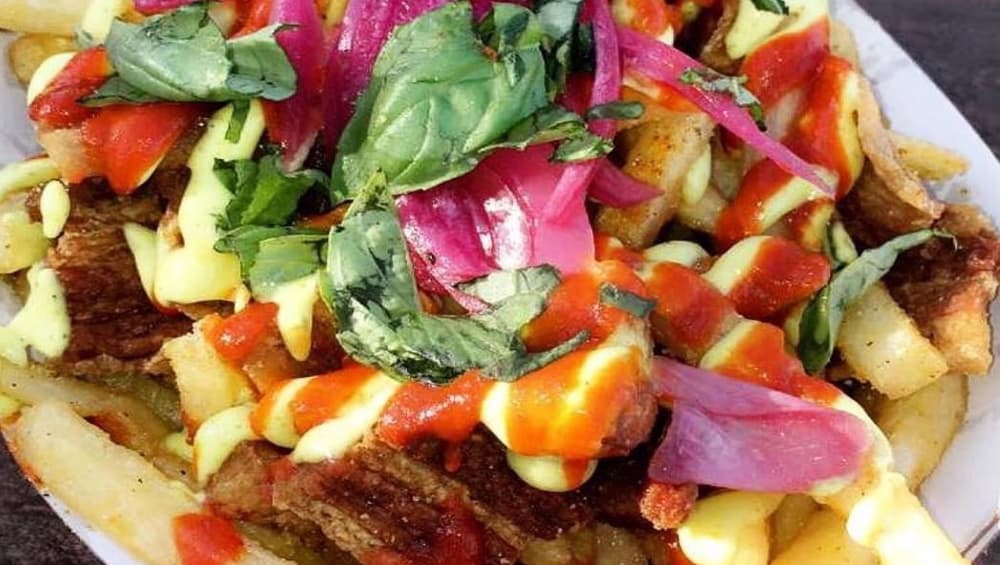 Strips of pork belly sprinkled liberally among fries. Strips of pork belly sprinkled liberally among fries.