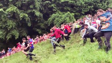 Participants Roll And Sprint Down a Hill in This UK's Annual Cheese-Rolling Race (Watch Video)