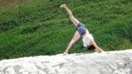 Woman Does Yoga Poses on Nearly Crumbling 200ft Cliff, Could Have Ended Up Dead! View Pics!