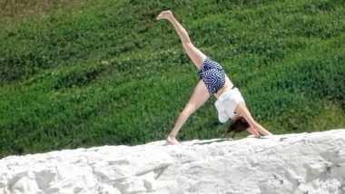 Woman Does Yoga Poses on Nearly Crumbling 200ft Cliff, Could Have Ended Up Dead! View Pics!