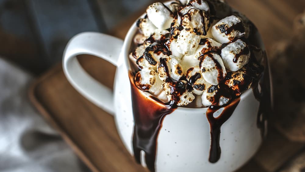 Hot chocolate is served with different kinds of toppings. Hot chocolate is served with different kinds of toppings.