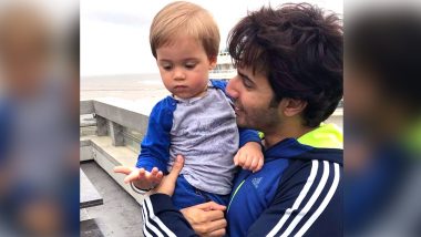 Varun Dhawan Enjoys the Rainy Weather with Yash Johar in This Absolutely Adorable Pic!