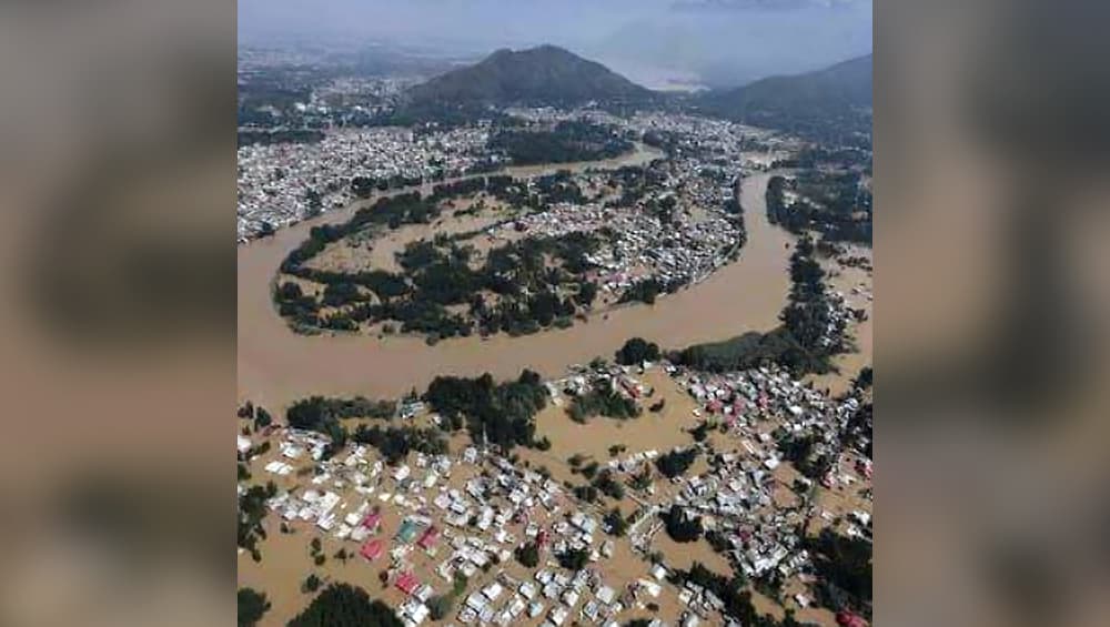 A bird's eye view of flooded Aluva in Ernakulam as monitored by the Indian Coastguard on a helicopter. A bird's eye view of flooded Aluva in Ernakulam as monitored by the Indian Coastguard on a helicopter.