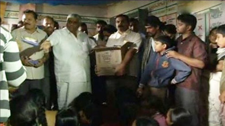 Karnataka Minister HD Revanna Faces Flak For 'Throwing Biscuits' on Flood Victims in Hassan: Watch Video