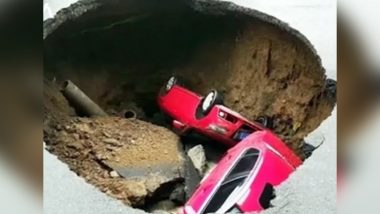 Two Cars Tumble Down Into a Sinkhole on a Busy Road in Northern China (Watch Video)