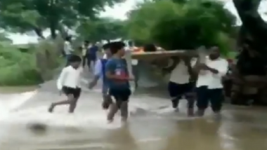 Madhya Pradesh: Villagers Carry Patient on Cot Across Flooded River Due to Bad Conditions of Roads in Damoh, Watch Video