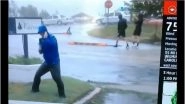 Weatherman Exaggerates Hurricane Florence Wind Force in North Carolina While Two Men Stroll by in a Viral Video