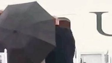 Donald Trump Mocked for leaving his Umbrella open at the door of Air Force One: Watch Video