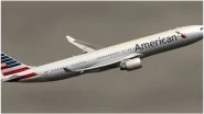 American Airlines Flight Diverted As Unruly Passenger Continues to Do Pull-Ups on Overhead Compartment