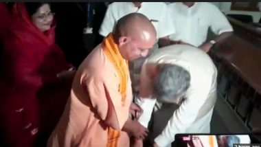 Chhattisgarh CM Raman Singh Touches Yogi Adityanath's Feet Before Filing Election Nomination: Watch Video