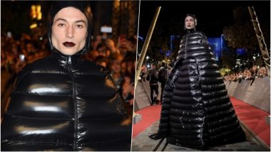 Ezra Miller Walks in a Shiny Puffer Coat at the Red-Carpet Event of Fantastic Beasts Premiere in Paris, See Pics