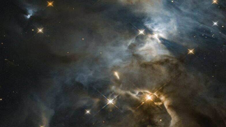 NASA's Hubble Space Telescope Spots Cosmic Smiley Among Colourful Galaxies NASA's Hubble Space Telescope Spots Cosmic Smiley Among Colourful Galaxies