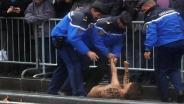 US Police Stop Topless Female Protesters Approaching Donald Trump Motorcade in Paris