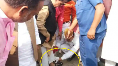 BJP Minister From UP Rajendra Pratap Singh Caught on Camera Getting His Sandals Cleaned by Staff Member in Kushinagar; Watch Video