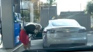 Woman Tries to Fill Petrol in 'Electric' Tesla Car, Funny Video Of Confused Blonde From US Goes Viral