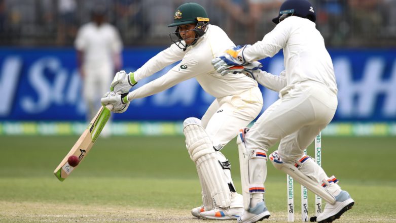 Virat Kohli and Ajinkya Rahane celebrate the wicket of Shaun Marsh