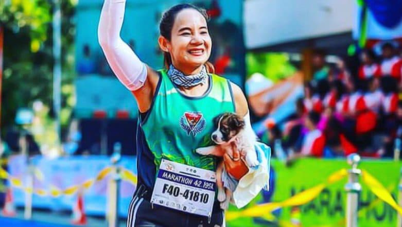 Marathoner Khemijra Klongsanun Finishes Race Holding an Abandoned Puppy She Found on Her Way in Thailand (See Pic) Marathoner Khemijra Klongsanun Finishes Race Holding an Abandoned Puppy She Found on Her Way in Thailand (See Pic)