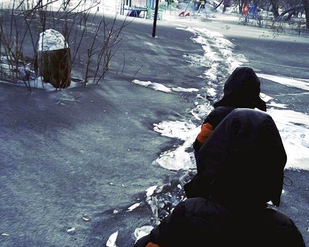 Walking through black snow covered roads. Walking through black snow covered roads.