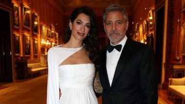 Amal Clooney Looks Angelic In A Floor-Length White Gown As She Accompanies George Clooney To The Buckingham Palace Party - View Pics