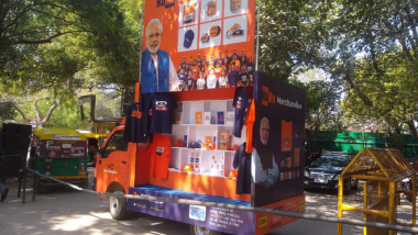 Namo Rath Selling T-Shirts, Pens, Badges and Masks Embellished With Modi’s Messages, Pulls Crowd at Narendra Modi’s Rally