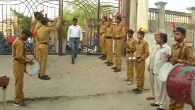 Uttar Pradesh Lok Sabha Elections 2019: Dhol And Flower Petals Welcome Voters at Polling Booth in Baghpat (Watch Video)