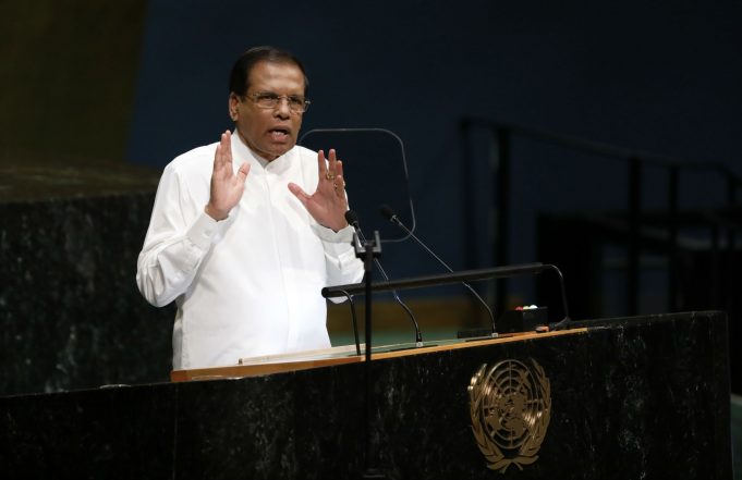 India's Prime Minister Narendra Modi shakes hands with Sri Lanka's  President Maithripala Sirisena during his welcome ceremony at the  Presidential Secretariat in Colombo