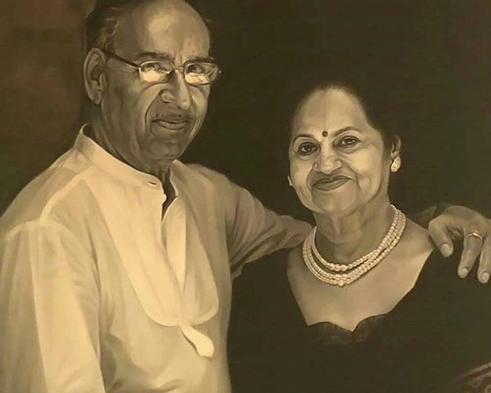 Veeru Devgan and Veena Devgan.