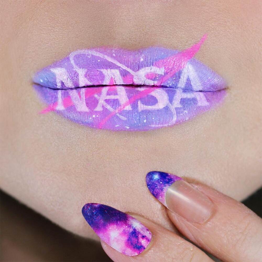 Makeup artist makes NASA logo on the lips. Makeup artist makes NASA logo on the lips.