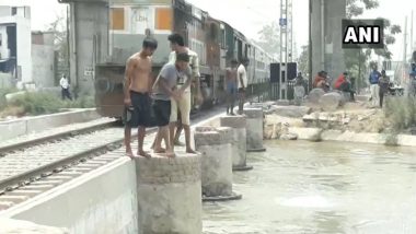 Ludhiana: Boys Perform Dangerous Stunt as Train Passes By, Jump Off Into Canal Beside Railway Track; Watch Video