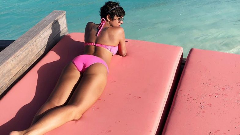 Mandira Bedi Looks Smoking Hot In A Pink Bikini As She Vacations In