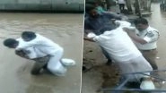 Hyderabad Traffic Cop Wades Through Waterlogged Road Carrying Man With Plastered Leg on His Back, Watch Video