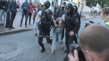 Russian Police Probe Video of Officer Beating Woman