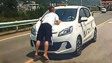 Furious Wife Rides 5km With Husband on Car's Bonnet in China (See Picture)