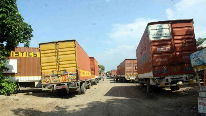 Maharashtra Police Nabs Two Containers Carrying 300 Migrant Workers