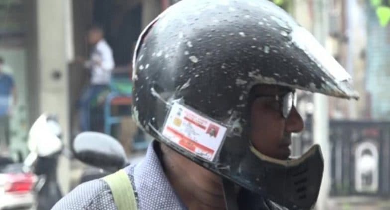 Motor Vehicle Amendment Act 2019: Vadodara Man Pastes All Documents Related to His Royal Enfield on Helmet to Avoid Fine, View Pics Motor Vehicle Amendment Act 2019: Vadodara Man Pastes All Documents Related to His Royal Enfield on Helmet to Avoid Fine, View Pics