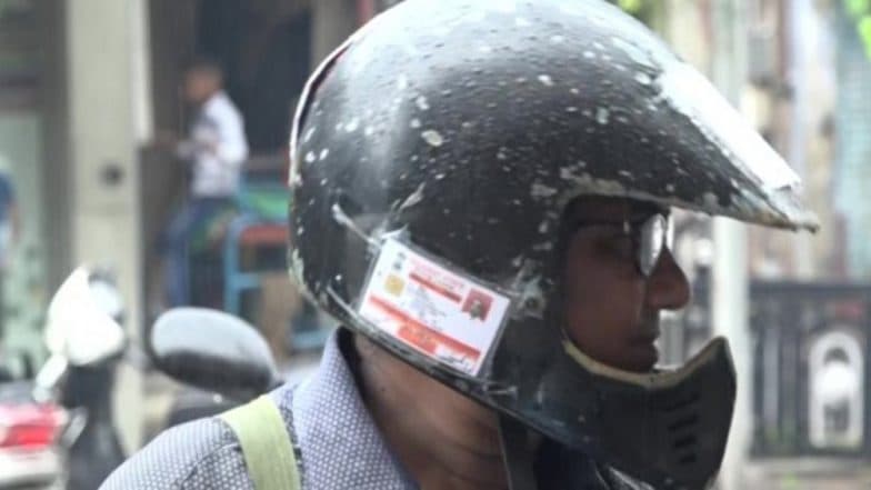 Motor Vehicle Amendment Act 2019: Vadodara Man Pastes All Documents Related to His Royal Enfield on Helmet to Avoid Fine, View Pics Motor Vehicle Amendment Act 2019: Vadodara Man Pastes All Documents Related to His Royal Enfield on Helmet to Avoid Fine, View Pics
