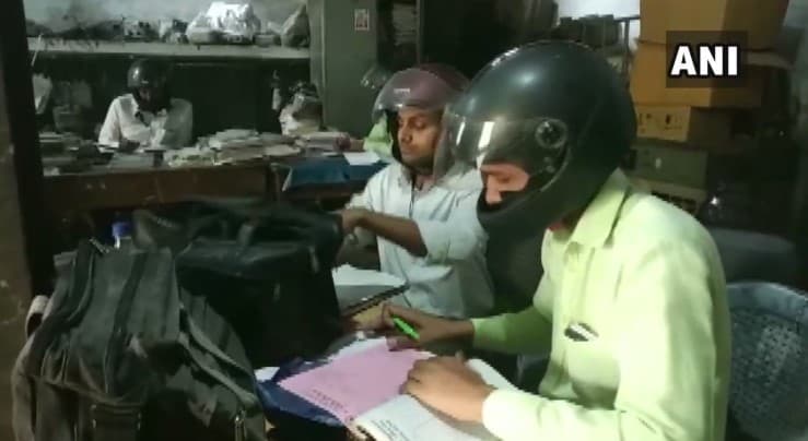 Shocking! Employees of Uttar Pradesh Government Office Wear Helmets While Doing Desk Job, Here's Why Shocking! Employees of Uttar Pradesh Government Office Wear Helmets While Doing Desk Job, Here's Why