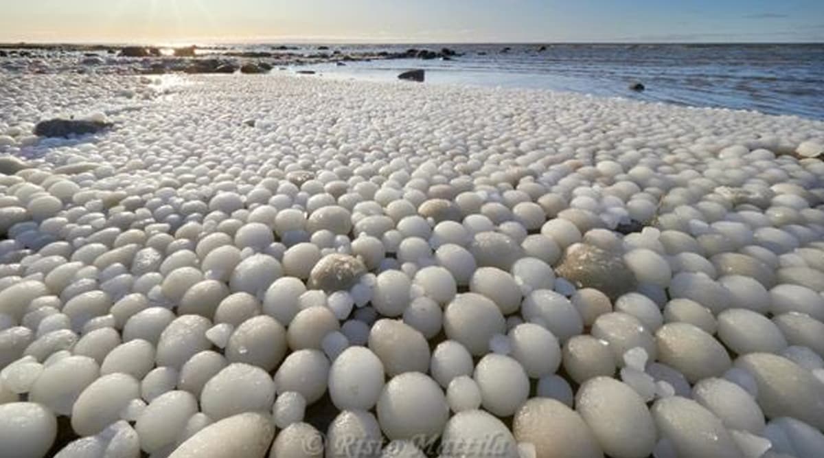 Photographer Captures Picture of Stunning 'Ice Ball' Phenomenon on Finnish  Beach