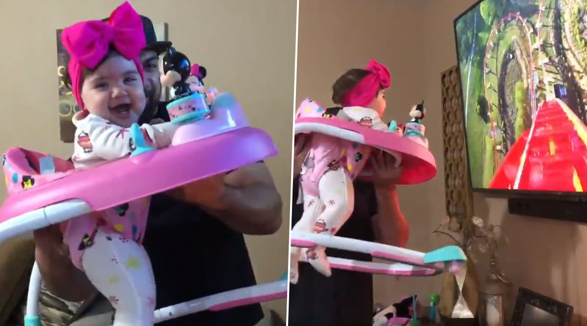 Baby Girl Can t Stop Laughing as Father Takes Her on a Fake Roller