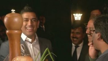MS Dhoni Attempts Whistling Using Spring Onion During an Event in Ranchi (Watch Video)