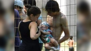Fact Check: Viral Picture of Woman Breastfeeding Baby Through Fence Shared With Fake Claim That It is From Detention Centre in Uttar Pradesh, Here’s the Truth