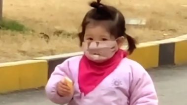 Little Girl Tries to Eat Biscuit Wearing Facemask in China, Her Perplexed Reaction Goes Viral (Watch Video)