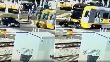 BMW Car Hit by Running Train in Los Angeles, Driver Escapes Miraculously (Watch Terrifying Viral Video)