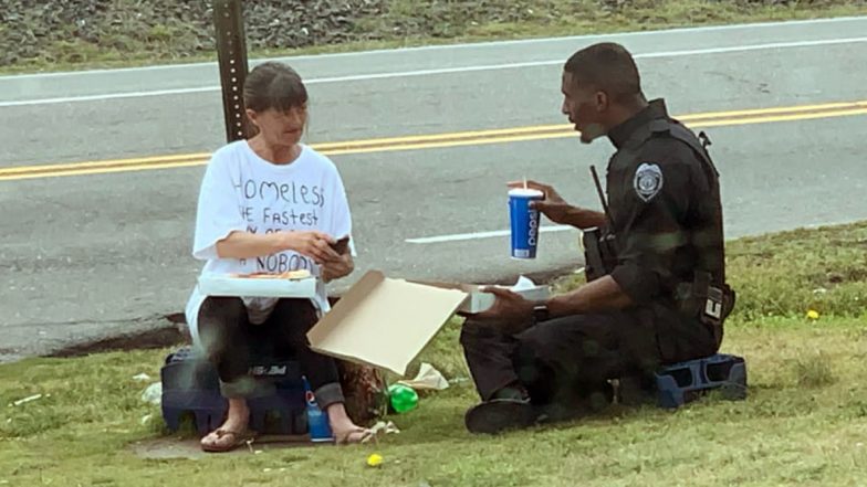 North Carolina Police Officer Shares Pizza With Homeless Woman During Lunch Break, Heart-Warming Photo Goes Viral