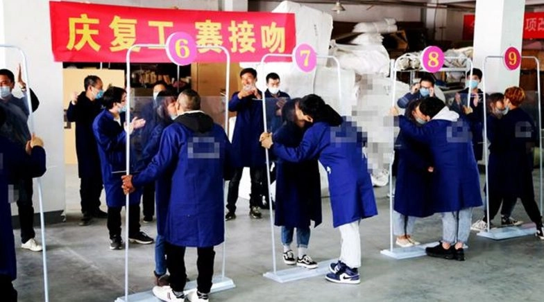 Chinese Factory Holds Social Distance Kissing Contest to Celebrate the Reopening After Lockdown